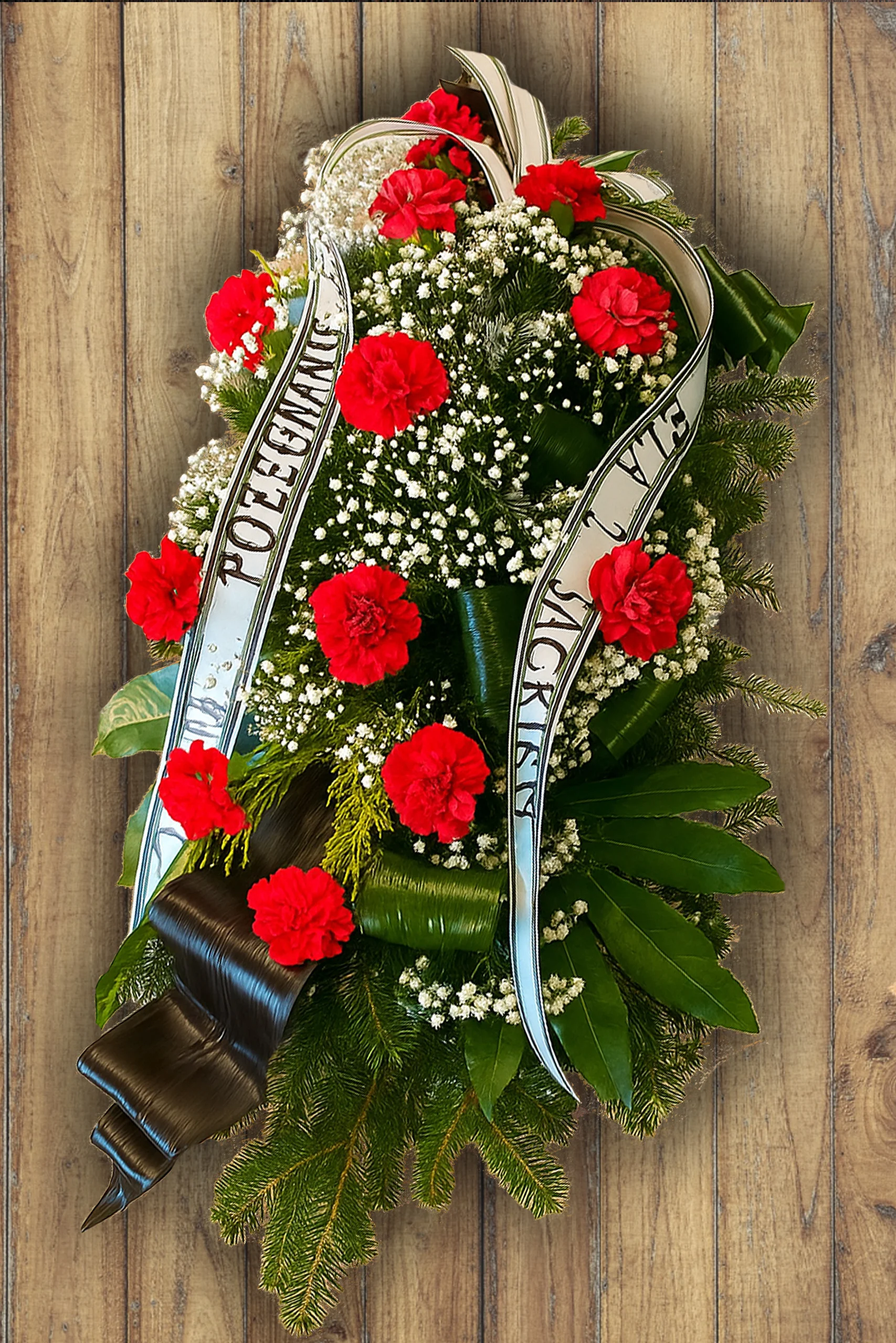 Wiązanka pogrzebowa z czerwonych goździków i białej gipsówki