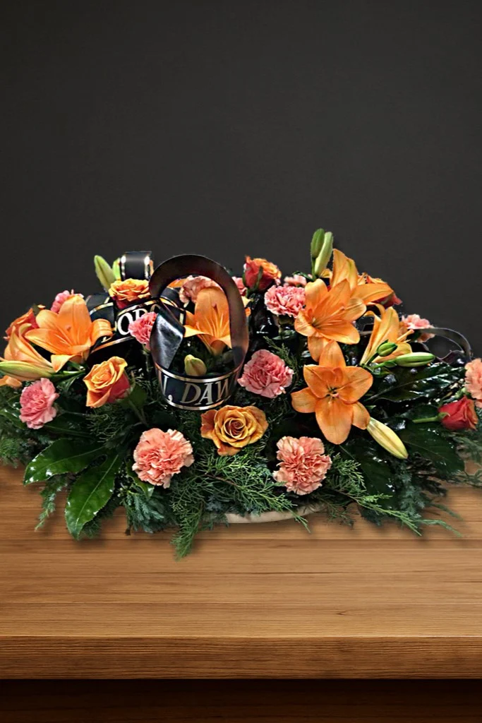 Stonowana wiązanka na pogrzeb w odcieniach pomarańczu